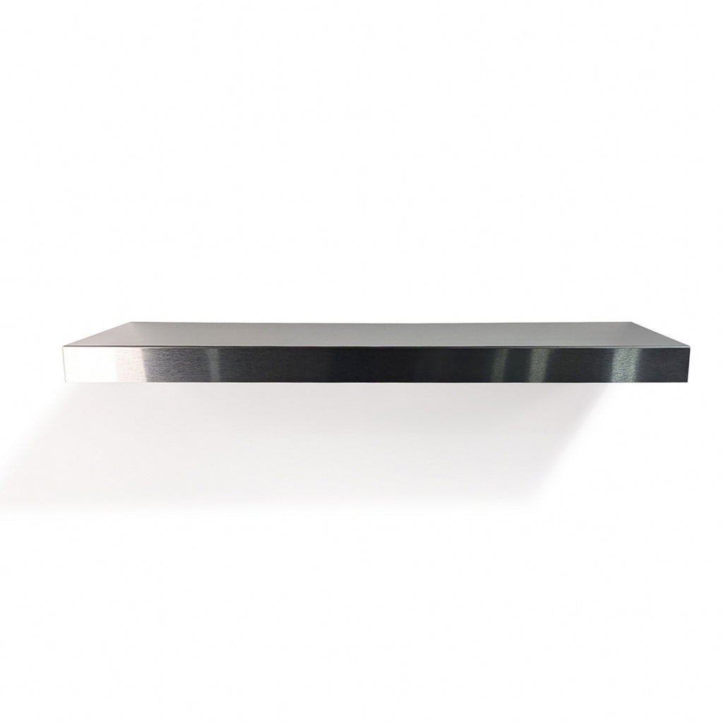 Frontal view of a made-to-measure floating stainless steel shelf by Fig & Forge, showing the seamless architectural design for a modern durable wall display