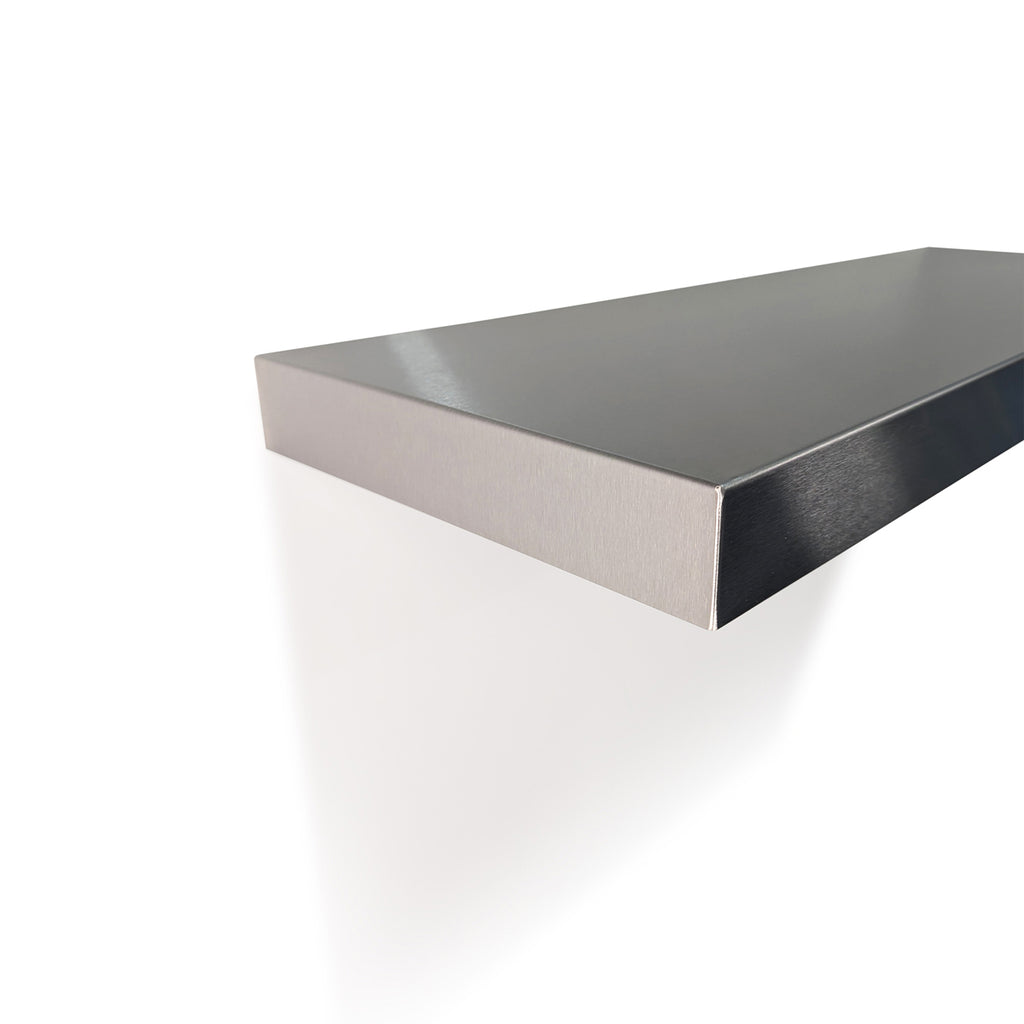 Detail view of a bespoke brushed metal floating shelf by Fig & Forge, highlighting the sleek minimalist profile and heavy-duty industrial construction