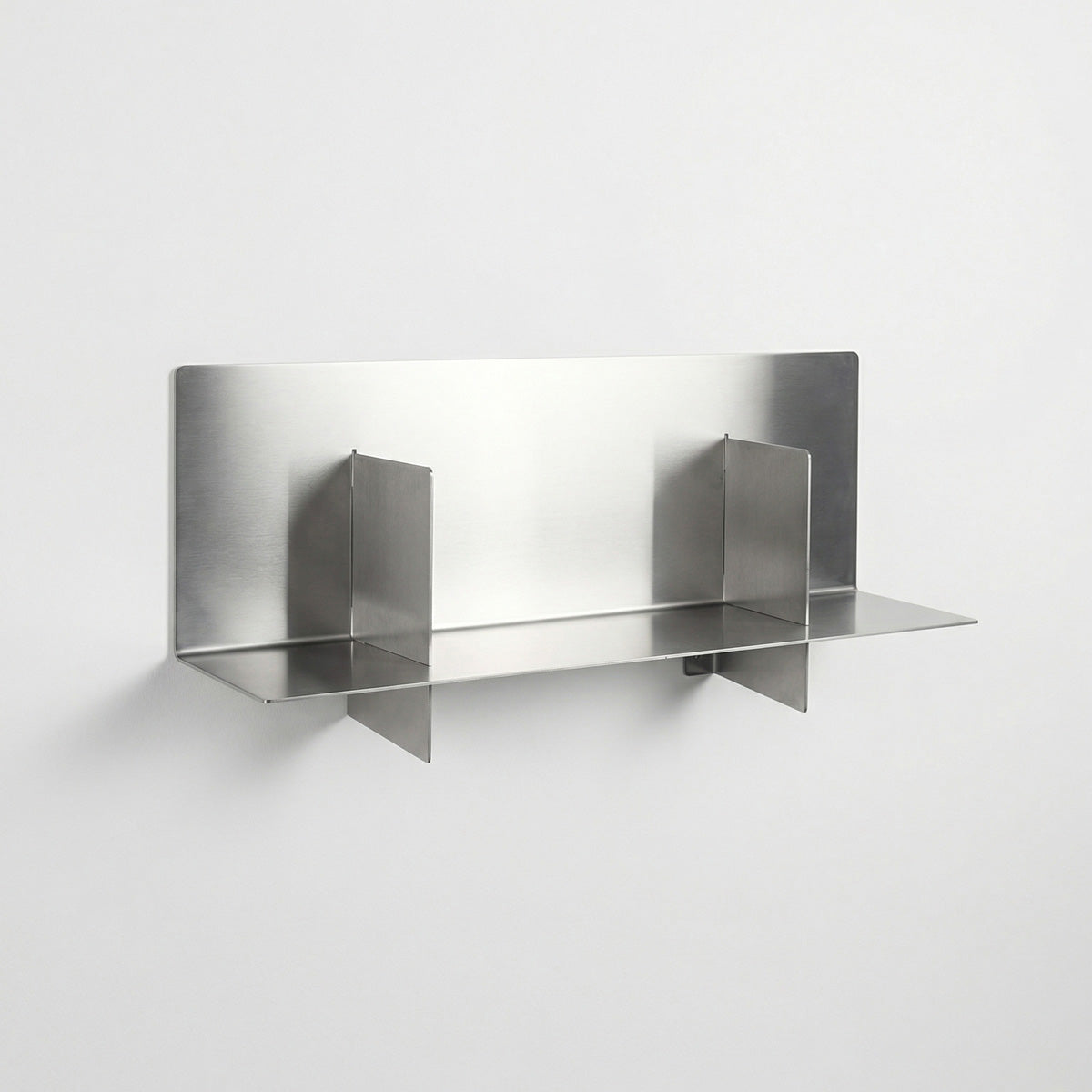 Perspective view of the custom Axis metal shelf by Fig & Forge, demonstrating the unique balanced geometry where vertical panels intersect the horizontal shelf