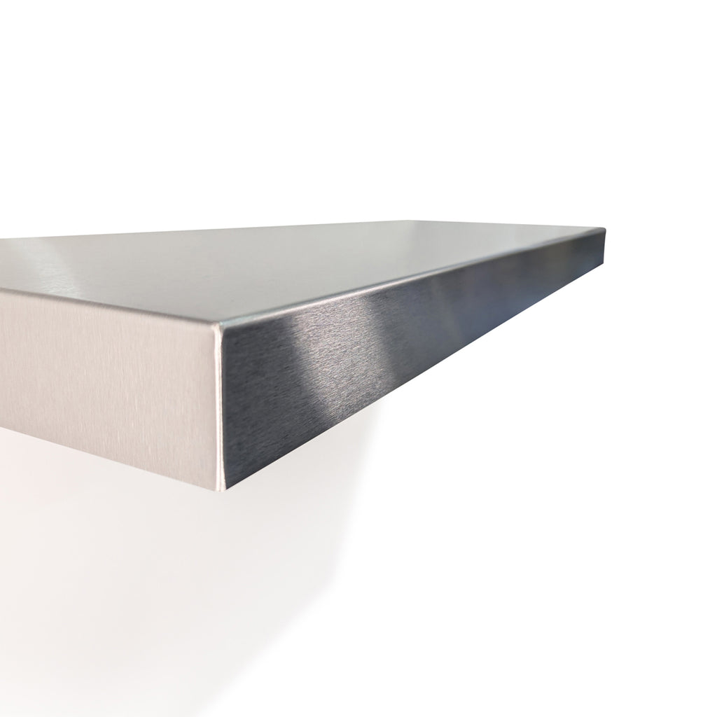 Close-up side view of a custom stainless steel floating shelf by Fig & Forge, showing the precision-bent corners and premium brushed designer finish