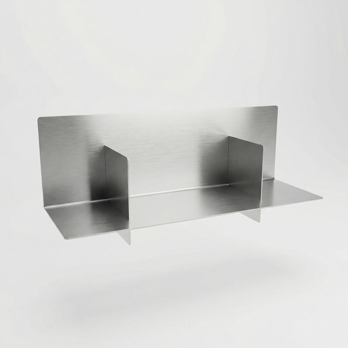 Bespoke Axis stainless steel floating shelf by Fig & Forge, highlighting the seamless structural joints and architectural-grade brushed metal construction