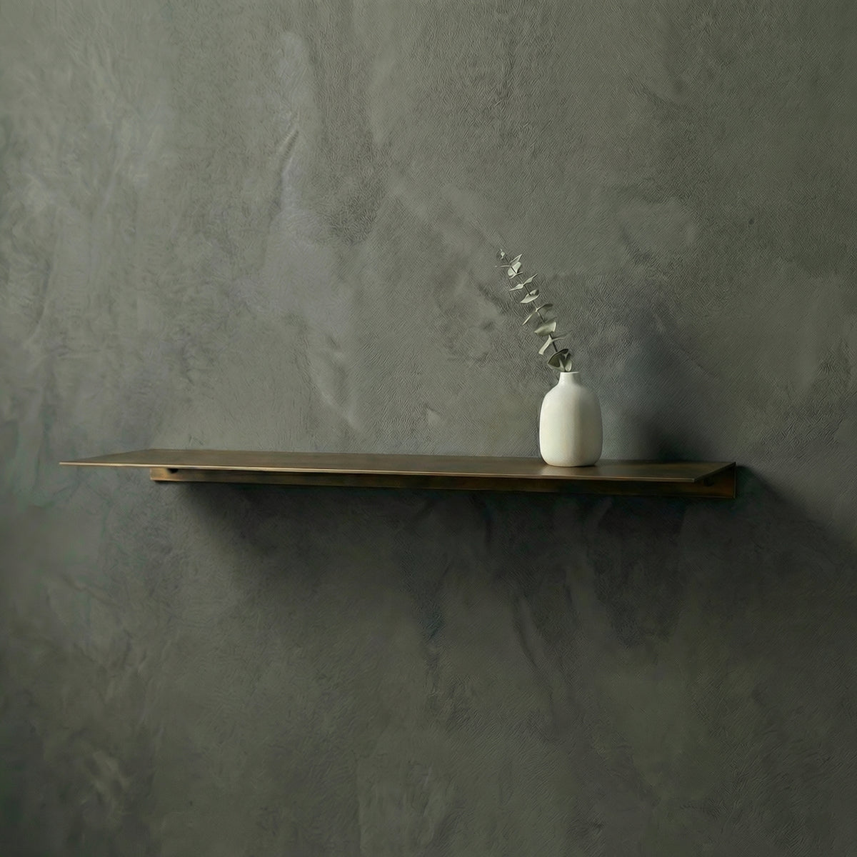 Bespoke floating shelf in a deep Champagne Gold color finish by Fig & Forge, precision-engineered for luxury home staging and minimalist wall displays