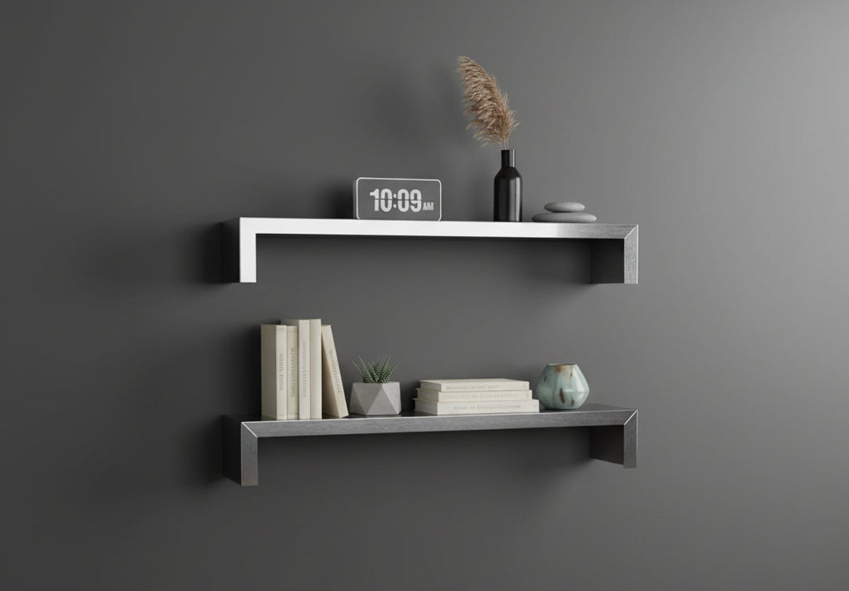 Set of two custom SmartSpan stainless steel floating shelves by Fig & Forge mounted on a charcoal wall, styled as a minimalist gallery for books and decor