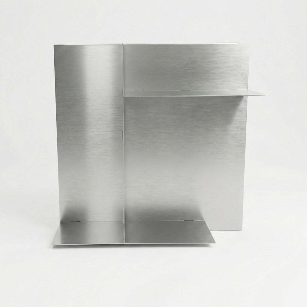Front view of a bespoke stainless steel panel shelf by Fig & Forge, demonstrating the seamless construction and discreet low-profile joints for a sleek finish