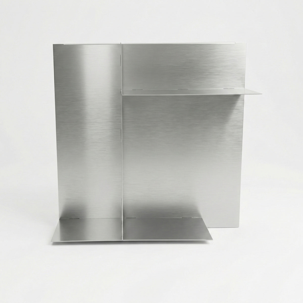 Front view of a bespoke stainless steel panel shelf by Fig & Forge, demonstrating the seamless construction and discreet low-profile joints for a sleek finish