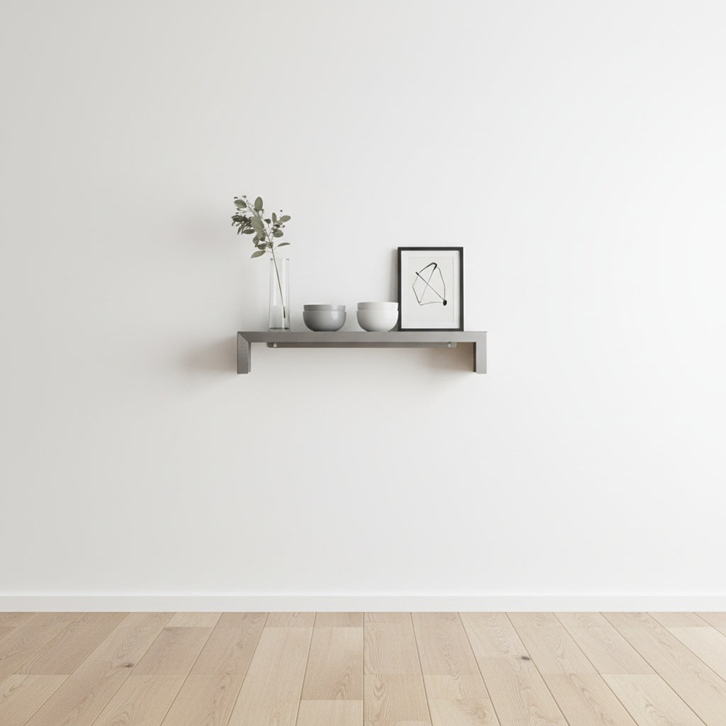 SmartSpan custom-width stainless steel shelf by Fig & Forge installed in a minimalist living room, styled with neutral decor for an architectural look