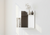 Home decor placed on minimalist geometric design custom-length stainless steel panel display shelf by Fig & Forge
