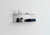 Custom two-tier floating shelf by Fig & Forge in a bright minimalist modern living room setting, providing sleek dual-level architectural design storage