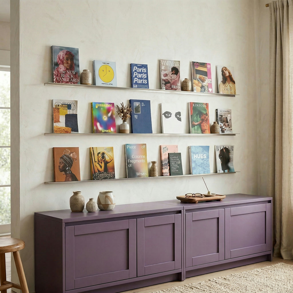 Ultra-slim wall ledges by Fig & Forge used as a minimalist picture gallery wall for displaying art and books in a modern living room
