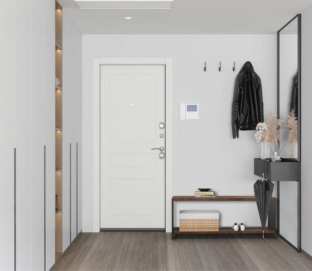 Architectural mudroom design featuring a custom Fig & Forge walnut bench in a clean white entryway, paired with a matching mirror and industrial wall hooks