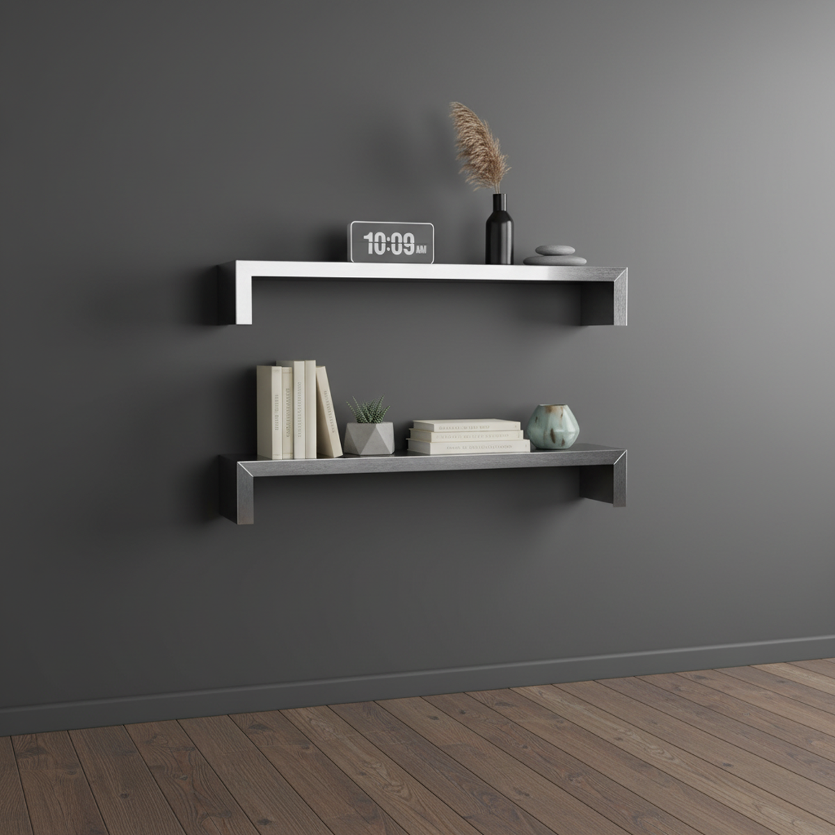 Set of two custom SmartSpan stainless steel floating shelves by Fig & Forge mounted on a charcoal wall, styled as a minimalist gallery for books and decor