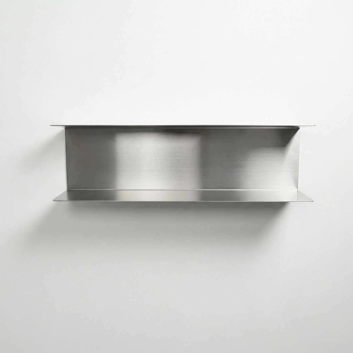 Front-facing view of a custom-sized two-tier floating shelf by Fig & Forge, precision-fit for seamless integration into high-end spaces